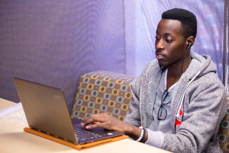 HSU Master of Science in Information Science student working on his laptop